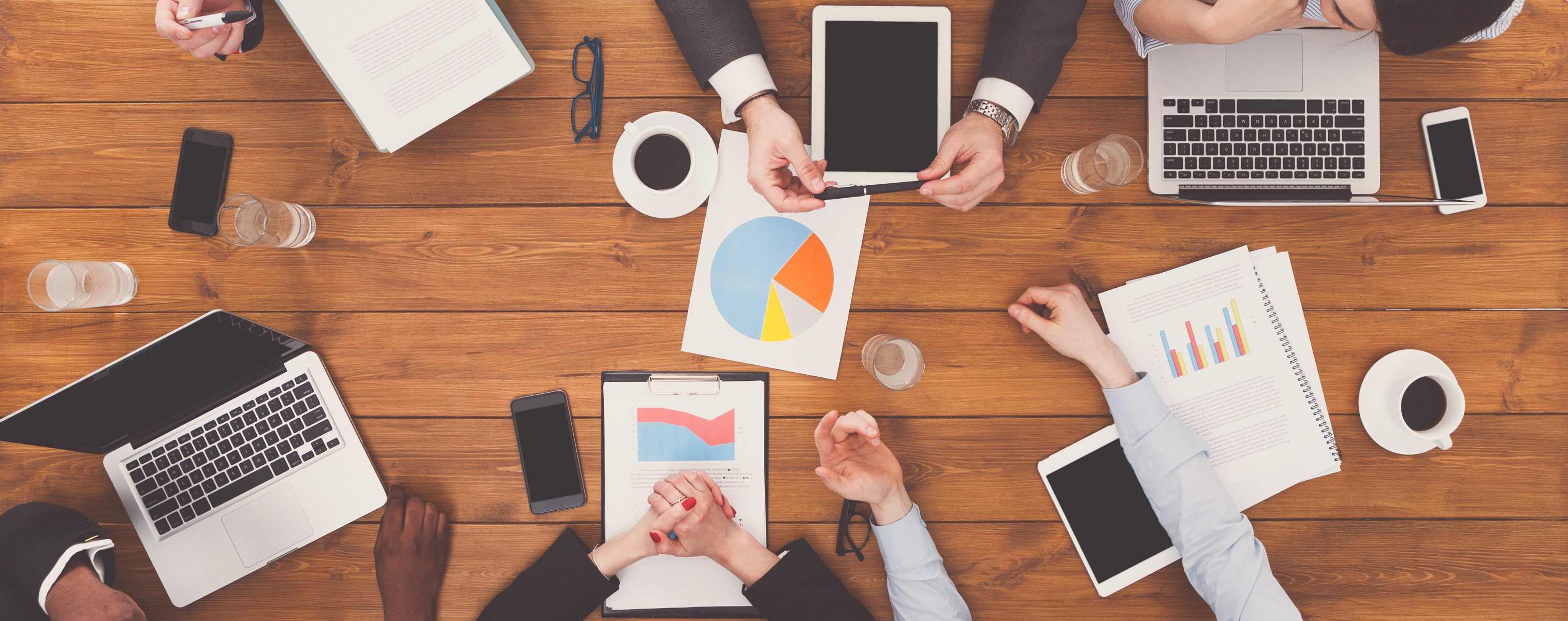 Group of busy business people meeting in office top view